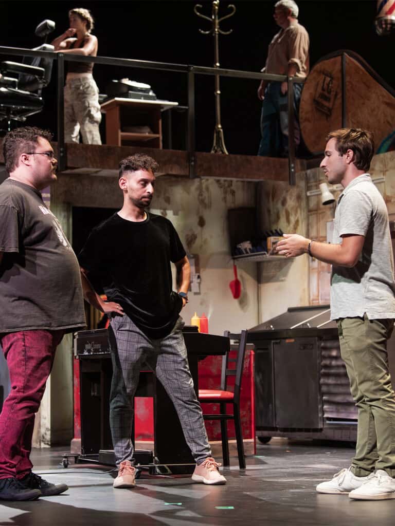 Photo: Coleman working with actors during Sweeney Todd.